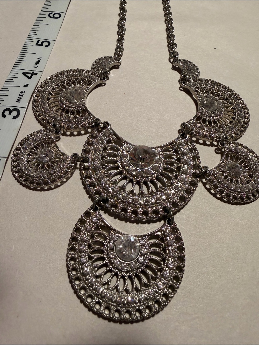 silver necklace tiered
